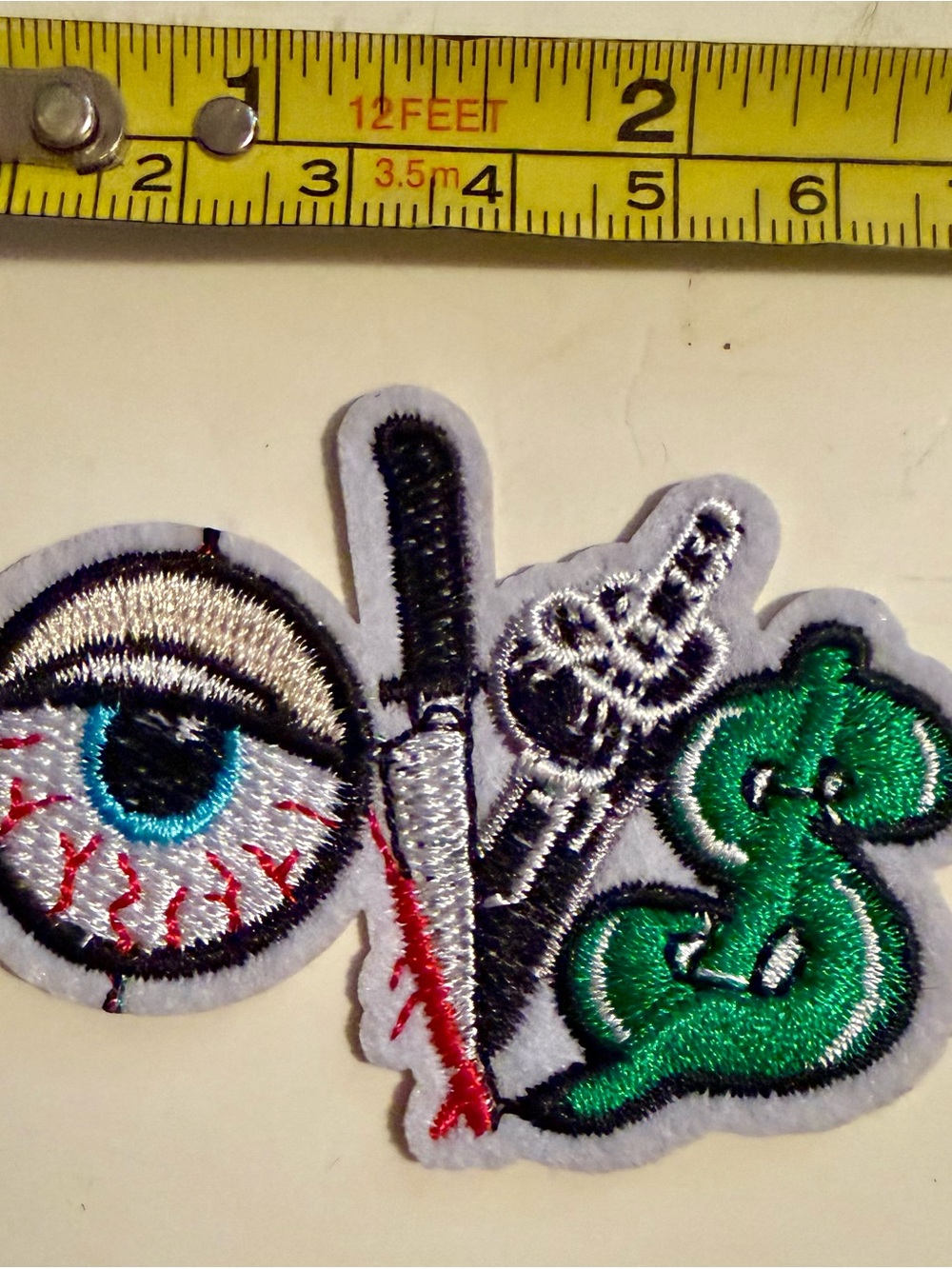 Eyeball, Knife & Dollar Sign Embroidered Patch - White, Black, Green